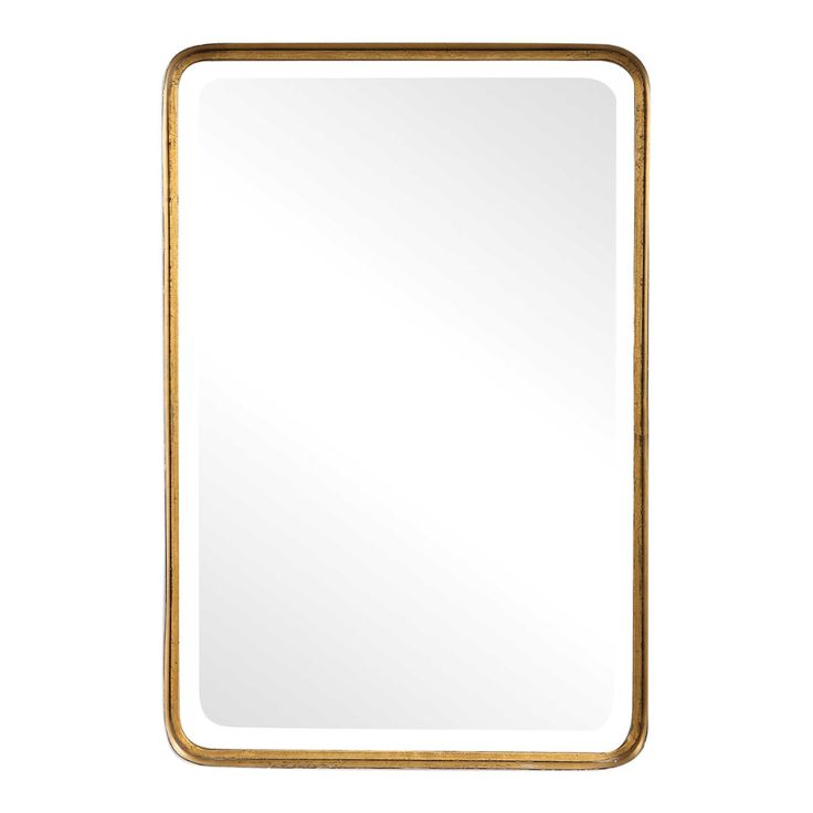 a gold framed mirror on a white background