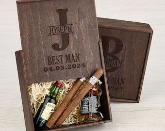 two personalized wooden boxes with cigars and liquor