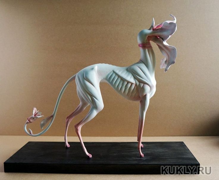 an animal made out of plastic sitting on top of a table