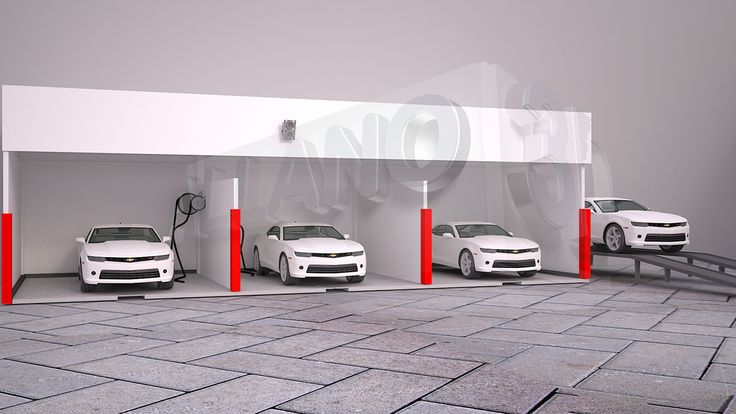 three white cars parked in a garage with red and white pillars on the side of it