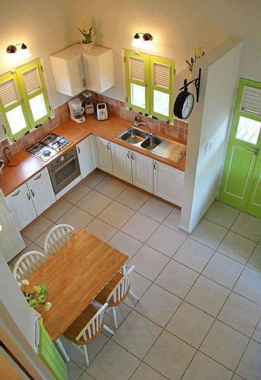 an aerial view of a kitchen and dining area