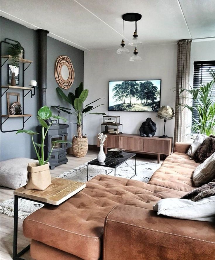 a living room filled with furniture and plants