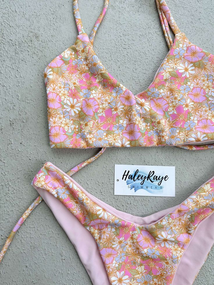 May: dainty pink, blue, and white florals Reversible to Light Pink Pictured: The Bali Top Hawaii Bathing Suit Bikinis, Hawaii Swimsuit Bikinis, Summer Swimsuit Aesthetic, Cute Tankini Bathing Suits, Swimsuit Basket, Cute Swimsuits For Teens Bikinis, Cute Bikinis For Teens Summer, Underwire Bikinis, Bathing Suit Brands