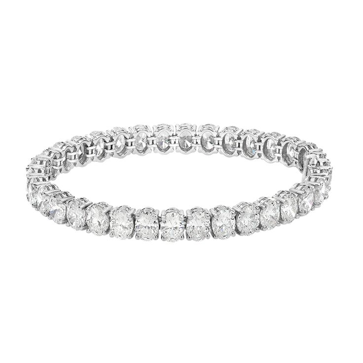 Oval cut diamond riviera line tennis bracelet is absolutely amazingly crafted in luxurious Platinum and made with 33 oval cut diamonds of each GIA certified stone 23.19carats! True fit for a queen. Everyone will gasp with thrill when seeing it on her wrist!Metal: PlatinumDiamond Weight: (33) Oval Cut Diamonds of 23.19ct t.w.Certified: All GIA certified diamonds Diamond Details: D - F color, SI+ clarityDimension: Width 6mm L: 17.7cm Oval Cut Diamond, Bracelet Crafts, Diamond Bracelets, Gia Certified Diamonds, Tennis Bracelet, Oval Cut, Diamond Bracelet, Platinum, Tennis