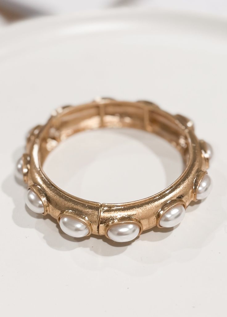 Slip this dainty bracelet on and complete your look! oval pearl stretch bracelet gold lightweight imported Floral Dress Casual, Pearl Bangle, Dainty Bracelet, Black Short Dress, Dainty Bracelets, Boot Accessories, Wedge Sneakers, Bracelet Gold, Dress With Cardigan