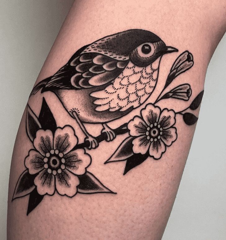 a bird sitting on top of a branch with flowers