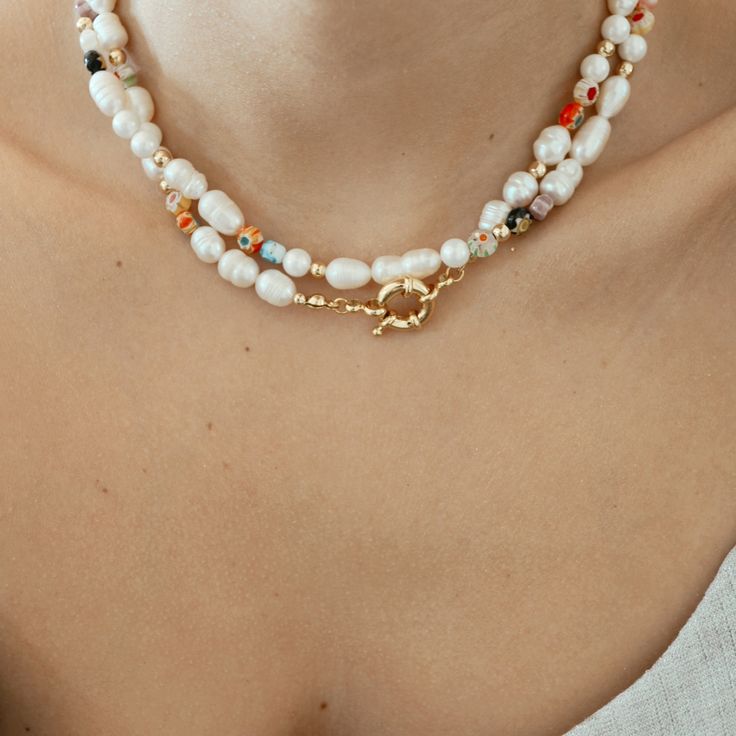 This Millefiori Pearl Necklace is a timeless piece suitable for any season to add a pop of color and fun to your outfit. Each necklace is beaded in a unique pattern, which means each necklace is different from the others, this delicate design makes it perfect for an effortless look. DETAILS:Water Resistant - Allergy-free18k Goldplated Stainless Steel Clasps, Ivory Freshwater Pearls, Millefiori Glass BeadsGold-filled seed beadsONE SIZE 16.5 inches NOTE: All designs are unique, photos are for refe Millefiori Jewellery, Boho Queen, Bead Creations, Bead Tips, Pretty Accessories, Unique Photos, Delicate Design, Jewelry Model, Gold Filled Jewelry