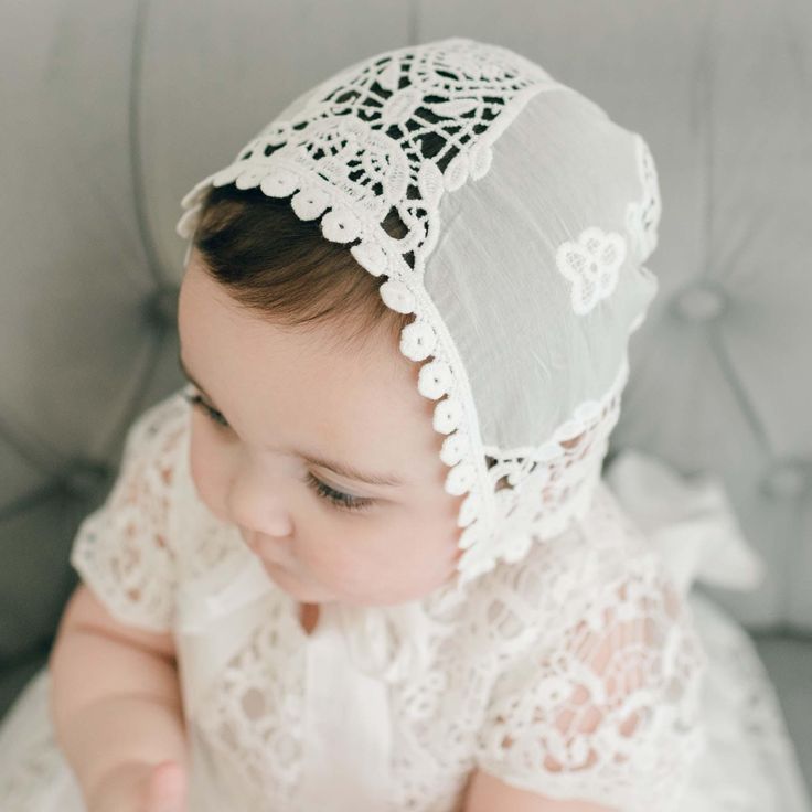 Grace Bonnet | Light Ivory Lace  **PLEASE NOTE, THIS ITEM IS NOT INTENDED AS/FOR INFANT SLEEPWEAR** An absolutely beautiful bonnet for your little girl's christening day. This lace bonnet is uniquely designed with richly embroidered light ivory lace and cotton floral edge lace at the back. It is a fitted style for a traditional feel that will have friends thinking it was passed down in your family for generations. The keyhole in the back is adjustable for a near custom fit to your little one- ju Cute Fitted Lace Baptism Dress, Cute Fitted Baptism Dress, Fitted Cute Baptism Dress, Cute White Baptism Dress For Wedding, Lace Baby Bonnet, Christening Gifts For Boys, Lace Bonnet, White Lace Romper, Baptism Gown