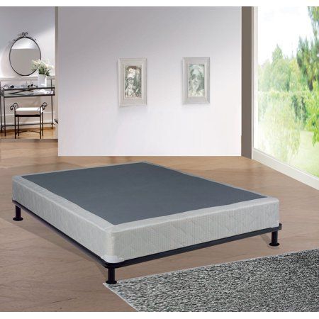 the mattress is placed on top of the wooden floor in front of an open door