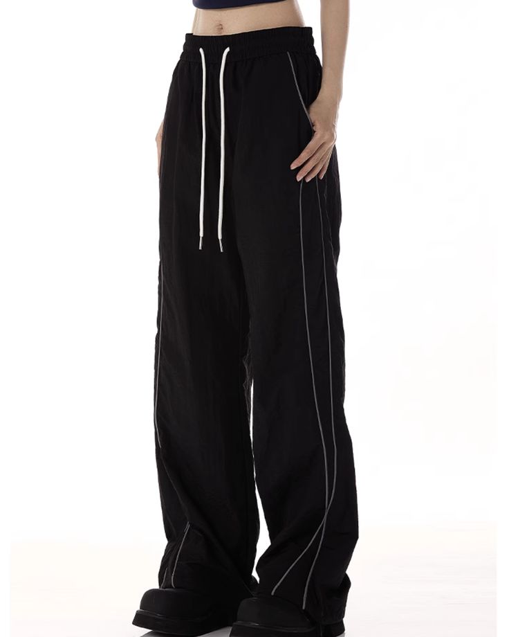 Track pants with a side line.

The loose silhouette makes it easy to wear.

A must-have item that has a loose yet fashionable feel and is perfect for a clean look.
◾️Model
Height/Weight：166cm(65.3in)/44kg(97.0lb)
Fitting Size：L
◾️Material
polyester  100%




Cm(inches)
Length
Waist
Hip


M
100(39.3)
68(26.7)
110(43.3)


L
102(40.1)
72(28.3)
114(44.8)


XL
104(40.9)
76(29.9)
118(46.4)


2XL
106(41.7)
80(31.5)
122(48) Spring Wide-leg Bottoms With Contrast Stitching, Casual Wide-leg Pants With Seam Detailing, Casual Wide Leg Pants With Seam Detailing, Casual Full-length Pants With Contrast Stitching, Casual Straight Pants With Seam Detailing, Casual Full Length Bottoms With Seam Detailing, Casual Solid Bottoms With Seam Detailing, Casual Bottoms With Seam Detailing, Casual Pants With Seam Detailing