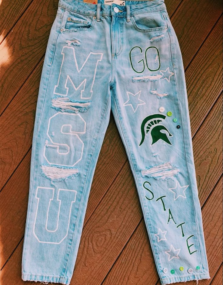 Painted Pants For Homecoming, Painting Pants For Homecoming, Cheer Painted Jeans, Junior Pants Ideas, Painted Jeans School Spirit College, College Pants Diy, College Decision Jeans, Painted Game Day Jeans, Spirit Jeans Ideas Cheer