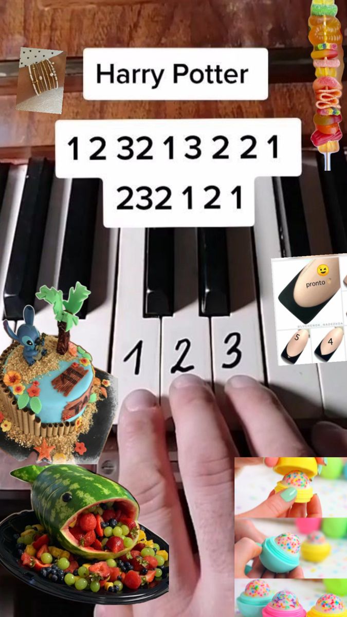 a hand holding a tiny cake on top of a plate next to a piano keyboard