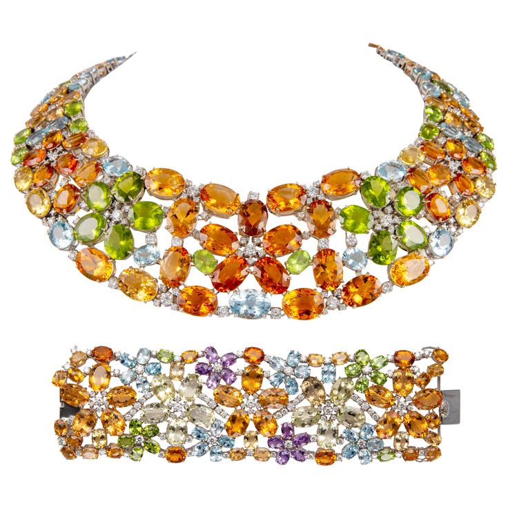 Statement mixed color stone with diamond necklace and bracelet set. By Alexander Beverly Hills. 304.87 carats total gemstone weight. Necklace 166.33 carats total gemstone weight. 154.51 carats of heliodor beryl, peridot, and aquamarine. 179 round brilliant diamonds, 11.82 carats. Approximately G/H color grade and SI clarity grade. 18-karat white gold, 16 inches. Bracelet 138.54 carats total gemstone weight. 128.00 carats of heliodor beryl, peridot, amethyst and aquamarine. 98 round brilliant diamonds, 10.54 carats. Approximately G/H color grade and SI clarity grade. 18-karat white gold, 7 inches. Willing to sell necklace or bracelet separately. Accommodated with an up-to-date digital appraisal by a GIA G.G. once purchased, upon request. Please contact us with any questions. Item Number N59 Art Deco Pendant Necklace, Colored Diamond Jewelry, Bezel Set Necklace, Funny Jewelry, Diamond Chain Necklace, Stone Necklace Set, Fancy Jewellery Designs, Necklace And Bracelet Set, Jewelry Brands