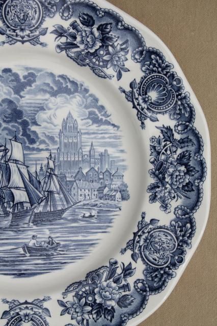 a blue and white plate with boats on it