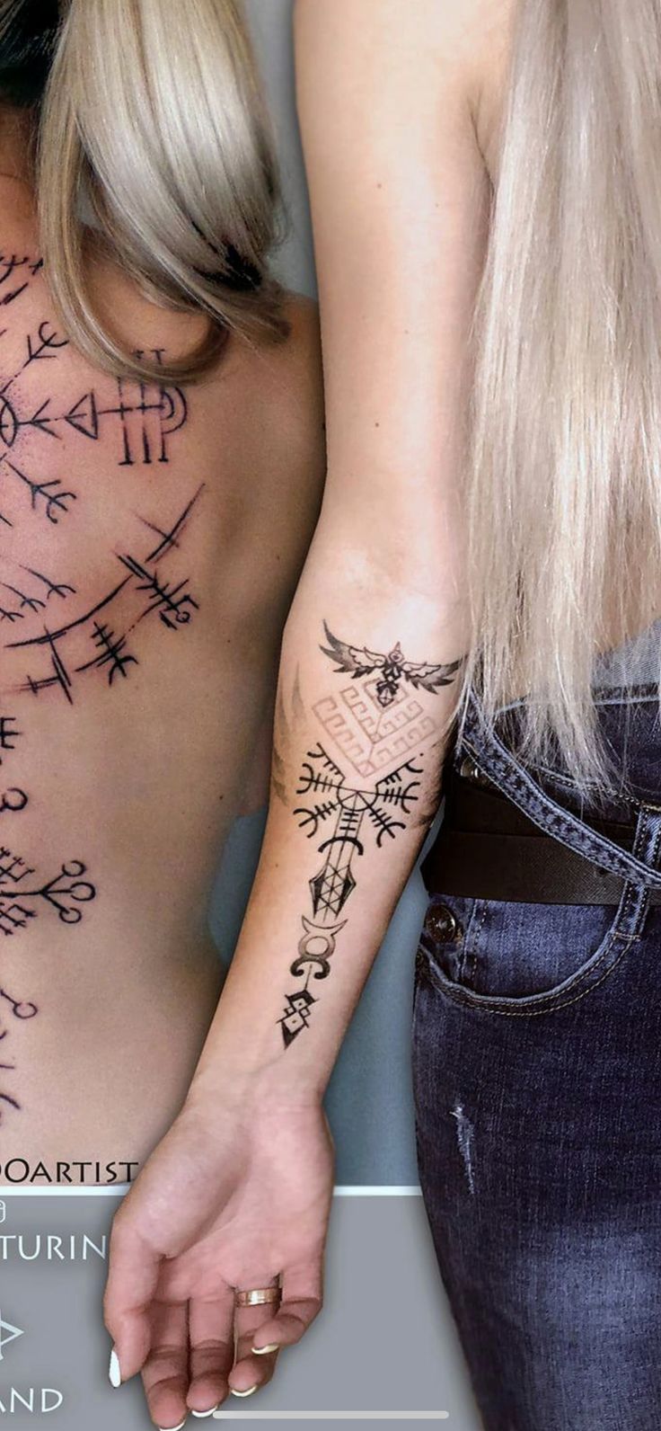 two people with tattoos on their backs and arms, one is holding the other's hand