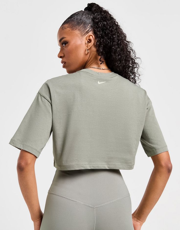 Upgrade your daily staples with this women's Swoosh Crop T-Shirt from Nike. In a Dark Stucco colourway, this tee is made with soft, lightweight cotton for lasting comfort. It features a ribbed crew neckline and short sleeves for a classic look, while the sleek cropped hem gives a boxy fit. Finished with a bold Nike Swoosh graphic stamped to the chest. Machine washable. | Our model is 5'7" and wears a size small. Dark Stucco, Chest Machine, Crop T Shirt, Nike Swoosh, Buy Now Pay Later, Jd Sports, Crop Tshirt, Sport Fashion, Classic Looks