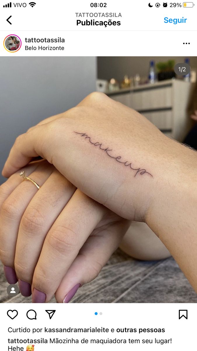 a woman's hand with the word love tattooed on her left wrist, in spanish