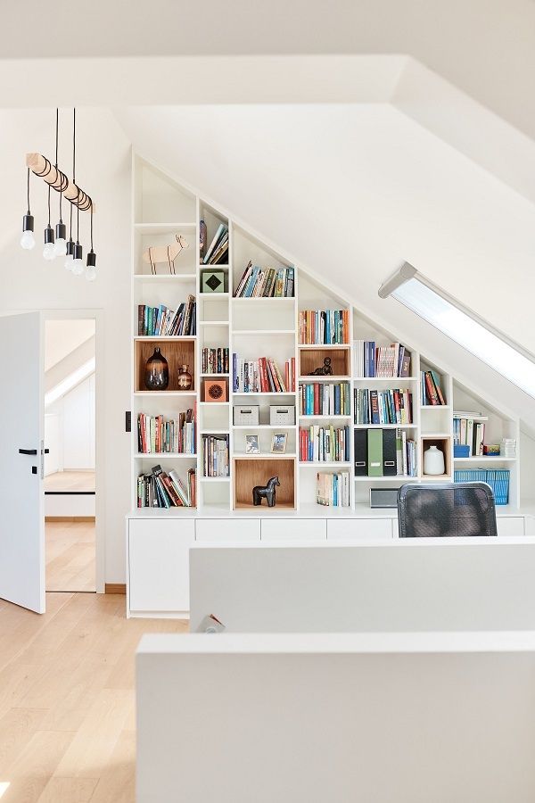 a room with some bookshelves in it