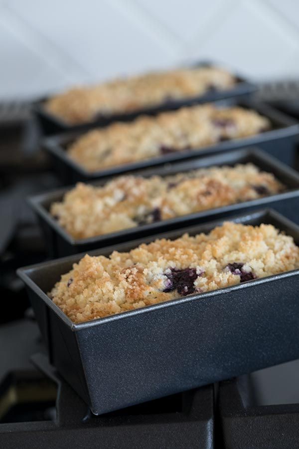 blueberry crumb bars are lined up in pans