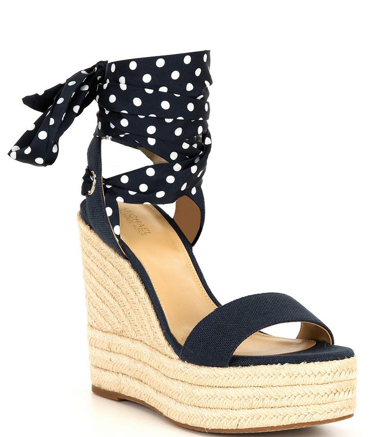 From Michael Kors&#x2C; the Esme Canvas Espadrille Wedge Sandals feature: Canvas upper with polka dot lace scarf Tie-up closure Synthetic lining Rubber outsole approx. 5" wedge height approx. 2" platform height Imported. Michael Kors High Heel Sandals For Summer, Michael Kors High Heel Summer Sandals, Michael Kors Round Toe Heels For Summer, Michael Kors Sandals For Beach In Spring, Chic Michael Kors Wedge Sandals For Summer, Polka Dot High Heel Sandals For Spring, Michael Kors Wedge Heel Sandals For Spring, Michael Kors Sandals For Spring Beach Outings, Michael Kors Casual Wedge Sandals For Vacation