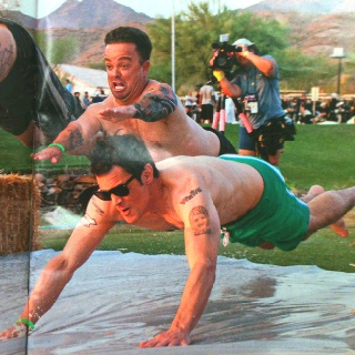 an image of two men doing tricks in the water