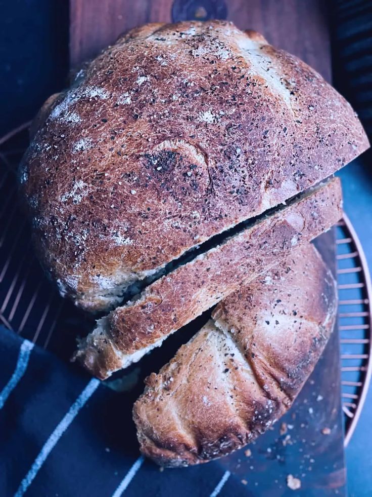 two loaves of bread sitting on top of a cooling rack