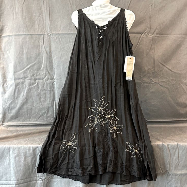 Black Beach Dress With Gold Flower Design Black Bohemian Sleeveless Sundress, Black Sleeveless Sundress For Vacation, Black Spring Vacation Dress, Black Sleeveless Beach Dress For Vacation, Sleeveless Black Beach Dress For Vacation, Sleeveless Black Beach Dress, Black Rayon Sundress, Black V-neck Sundress For Beach, Black Sundress For Beach Season