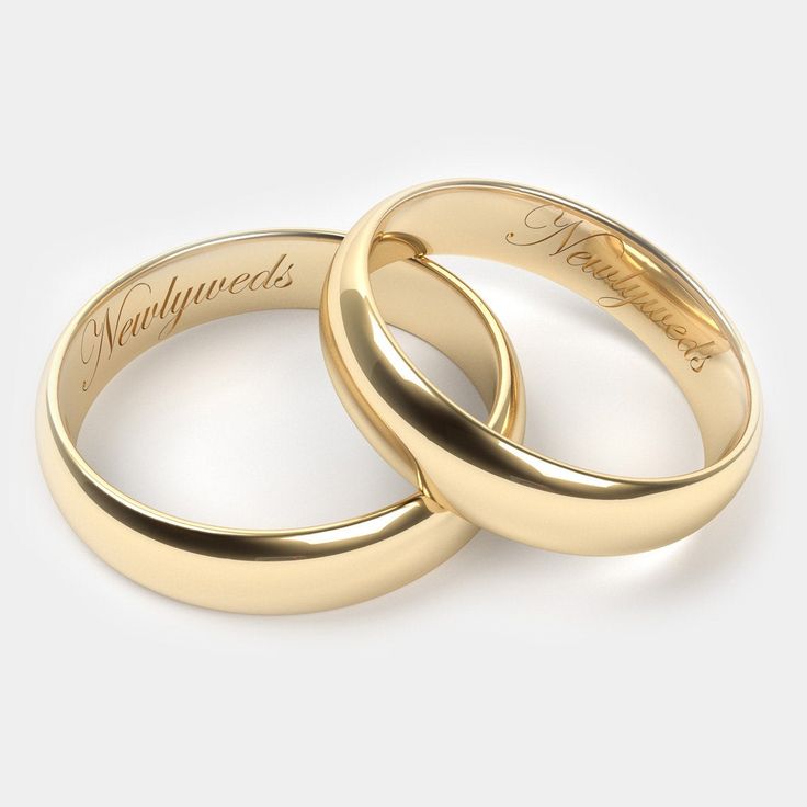 two gold wedding rings with the word love written on each one and an inscription that says,