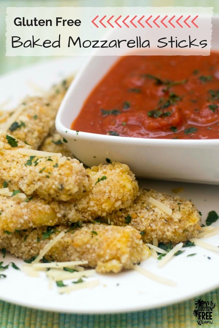 baked mozzarella sticks on a plate with sauce