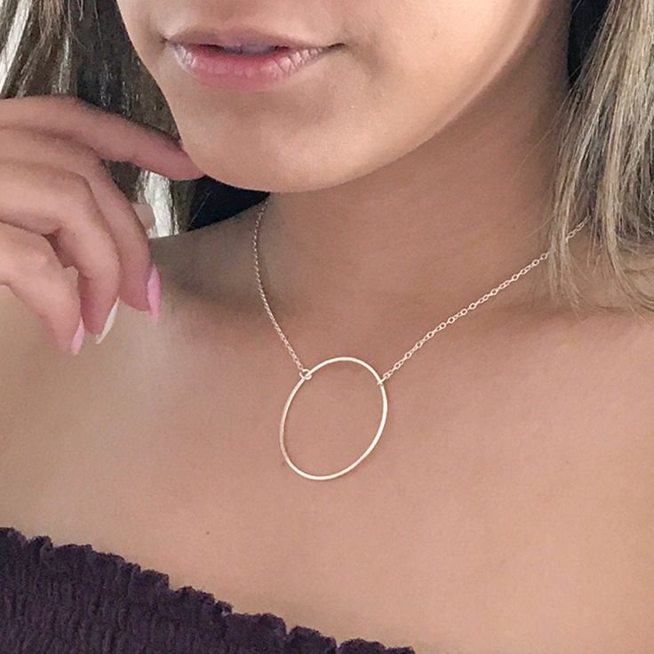 A sure conversation piece, this gold karma or eternity circle necklace is lightweight and dainty, yet noticeable enough to make a statement. This 14k gold filled necklace features a large gold eternity circle. The circle is about 1.5 inches. This necklace is also available in sterling silver. Lengths from 16 - 20 inches are available. If you need another length, please email me. The model is wearing a 16 inch length. Your new circle necklace will arrive in a complimentary gift box. To see other Halo Open Circle Necklace, Delicate Chain Open Circle Necklace, Minimalist Halo Necklace For Gift, Minimalist Halo Necklace As Gift, Minimalist Halo Necklace For Gifts, Minimalist Halo Round Pendant Jewelry, Everyday Circular Charm Necklaces, Everyday Circle Charm Necklaces, Minimalist Circle Charm Necklace