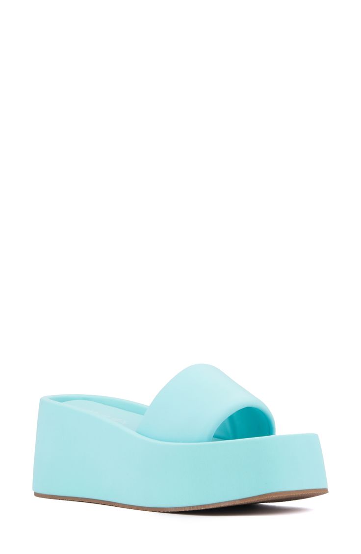 With a cushy insole, this casual slide sandal offers lasting comfort to be a weekend wardrobe favorite. 3 1/2" heel Textile upper and lining/synthetic sole Imported Comfortable Summer Slides With Wedge Heel, Synthetic Platform Slide Sandals, Platform Slides Made Of Synthetic Material, Casual Foam Slide Sandals, Light Blue Synthetic Slip-on Slides, Synthetic Platform Slides, Spring Foam Slip-on Slides, Blue Round Toe Platform Slippers For Spring, Light Blue Synthetic Slides With Round Toe