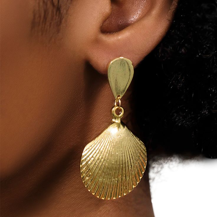 Make a beachy statement with these shell earrings! They��’re perfect for letting everyone know you’re in the summertime spirit. Pair with the matching necklace or wear with something daintier and let the Mar earrings take center stage. Composition 14k﻿ Gold Plated Brass Style With the Lala Top, a Short Set, or your fave bikini. In The Summertime, Ear Style, Rose Lily, Easy Tiger, Black Aviators, Black Tank Dress, Four Horsemen, Neon Purple, Shell Earrings