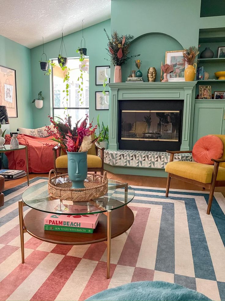 a living room filled with furniture and a fire place in the middle of the room