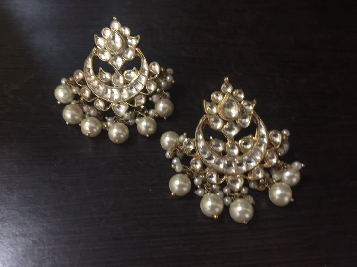 *It's Handmade Indian Ethnic Kundan Chandbali Earrings with white kundan and Pearl drop. *It's made from Silver n Copper with White Kundan Stones Settings with 22k gold Plating as shown in picture. *It it Pure Ethnic Look with Antique Touch and 1.8 inch size. *Our all jewelry is made from semiprecious stones and beads. *WARRANTY: ITS GENUINE HANDMADE JEWELRY AND WE ARE GIVING LONG LIFE WARRANTY FOR OUR ALL ITEMS. All of our Kundan Jewelry is 100% handmade with ancient Kundan stone setting method Elegant White Earrings For Navratri, Festive White Danglers With Intricate Design, White Cutdana Earrings For Festive Occasions, White Cutdana Earrings For Celebration, Elegant Handmade Bridal Earrings For Diwali, Festive White Cutdana Earrings, White Danglers With Cutdana For Celebration, Traditional White Danglers With Intricate Design, Handmade Elegant Chandbalis For Festivals