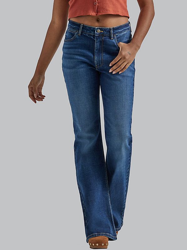 FLARED & FLATTERING It's our signature high rise fit and a fun, flared leg opening. The Wrangler® women's high rise Fierce Flare jeans feature our most flattering fit at the waist as well as a contoured waistband specially crafted for comfort that fits every body. These women's flare jeans are designed with plenty of stretch to keep you comfortable, even on your busiest days. Their '70s-inspired flared leg offers a touch of drama that adds a stylish edge to every outfit. Men's Retro Style, Womens Flare Jeans, Shirt Jacket Men, Western Women, Wrangler Jeans, 70s Inspired, Dark Wash Denim, Trouser Jeans, Flare Jeans