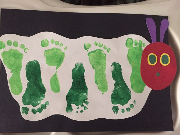 a child's hand and foot print made to look like a caterpillar