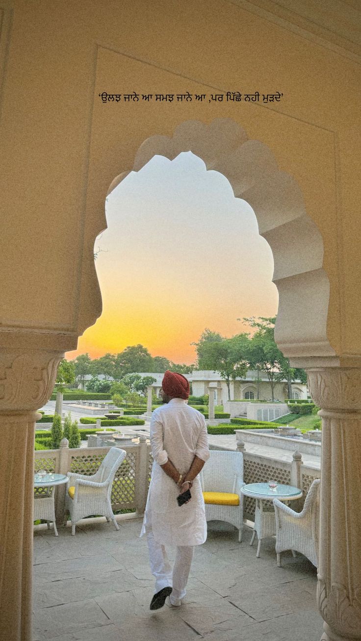 a man is walking through an archway