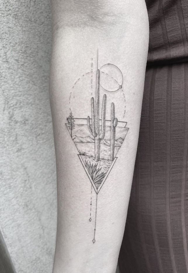 a woman's arm with a tattoo on it and a cactus in the middle