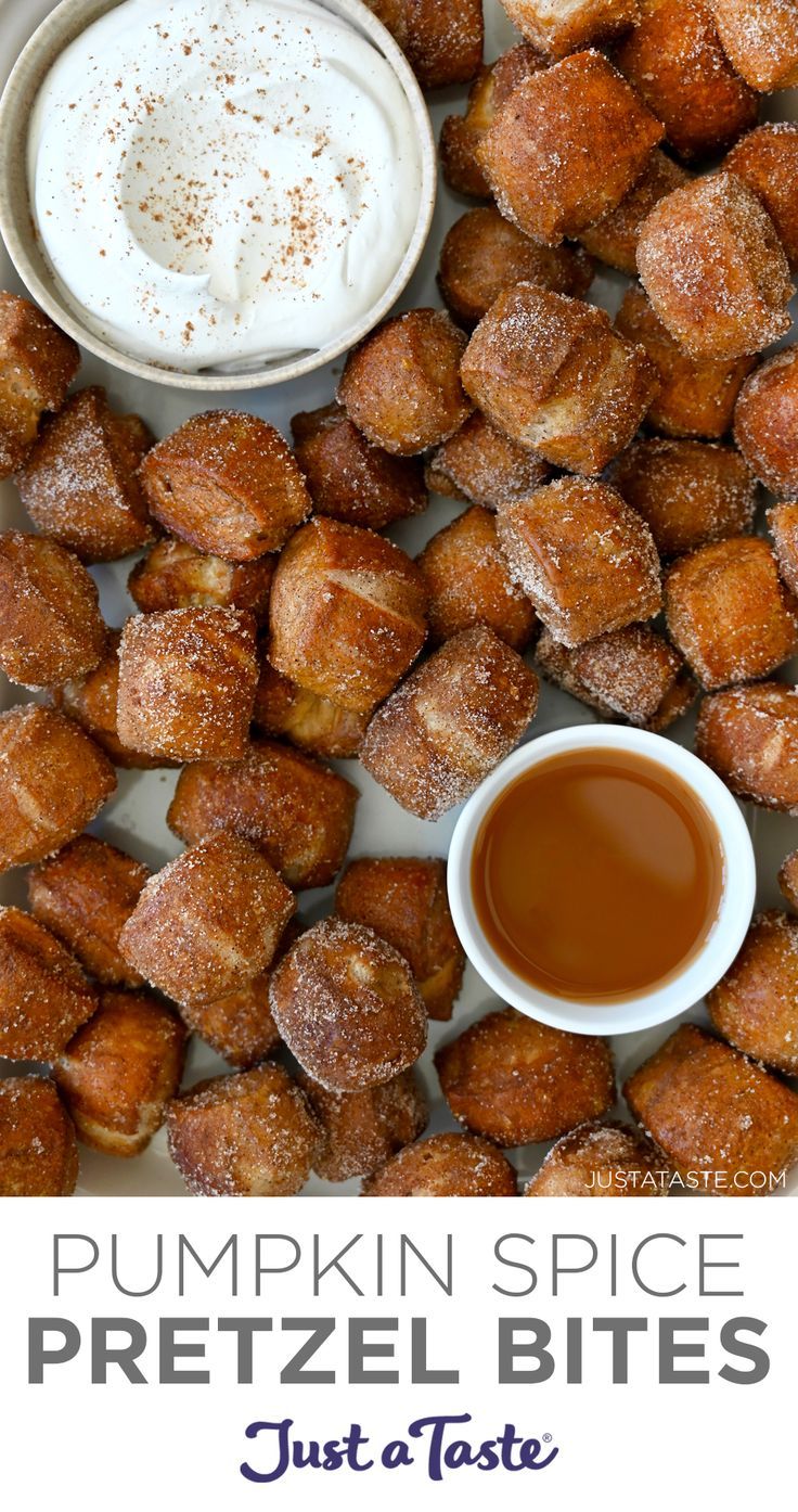 A close-up view of pumpkin spice pretzel bites surrounding two small bowls containing whipped cream and caramel sauce. Pumpkin Spice Pretzel Bites, Pumpkin Soft Pretzels, Pumpkin Spice Appetizers, Pumpkin Spice Pretzels, Pumpkin Spice Snacks, Stuffed Pretzel Recipe, Pumpkin Pretzels Recipe, Fall Pretzels, Spiced Pretzels