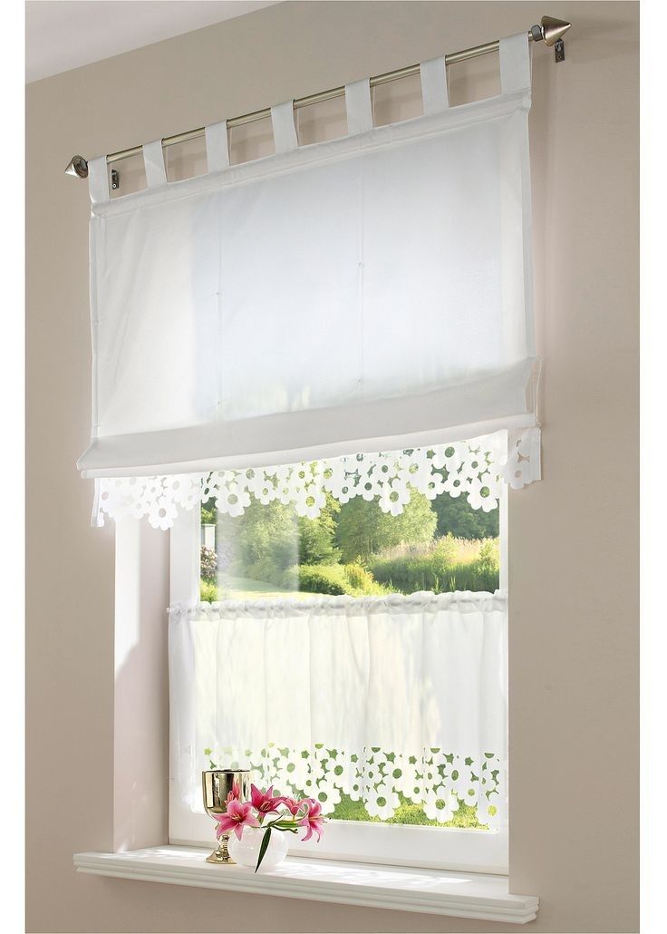 a window with white curtains and pink flowers in the vase next to it on a windowsill