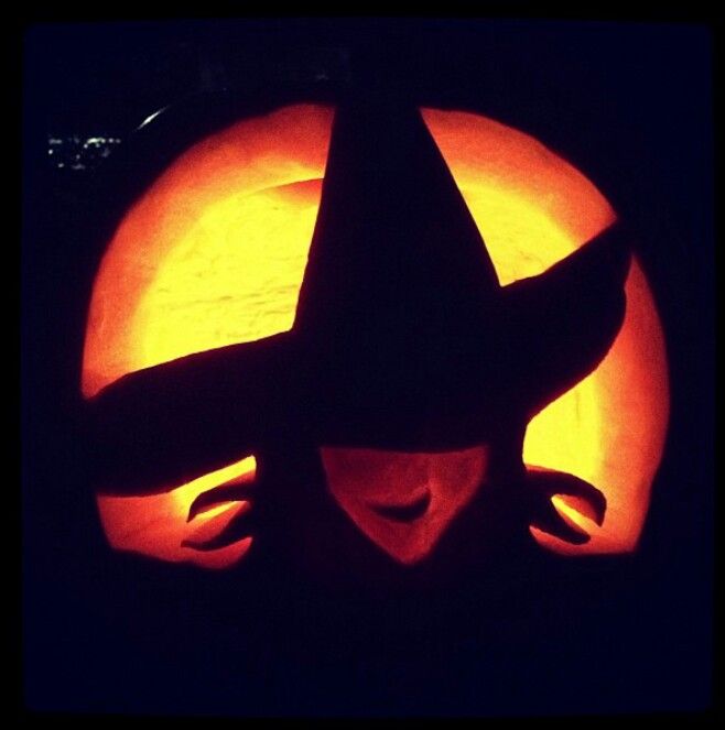 a pumpkin carved to look like a witch's hat