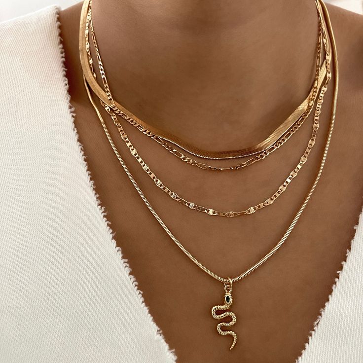 Delicate mariner anchor link chain is perfect to wear alone or layer with other necklaces. 14k Gold Filled Chain Length: 18” Width: 2.6mm Lobster clasp closure Hypoallergenic Water resistant & tarnish free Nickel & lead free Layered Chains Gold, Gold Chain Stack, Gold Layered Chain Link Necklace, Layered Gold Necklaces Aesthetic, Gold-tone Layered Chain Necklace Gold Plated, Gold Snake Chain Layered Necklace, Gold Stacked Necklaces, Stacked Gold Necklaces, Chic Gold-tone Layered Necklace With Gold Chain