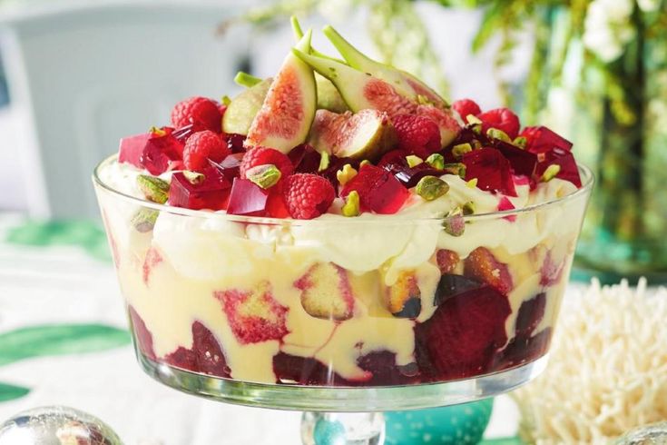 a fruit trifle is displayed in a glass dish