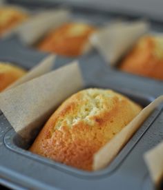 some muffins are in a plastic tray