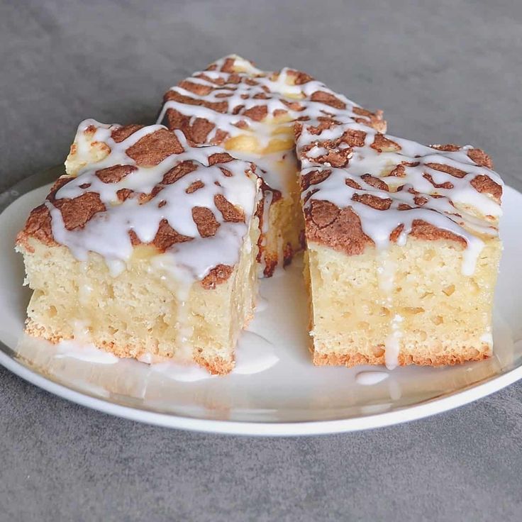 a white plate topped with slices of cake