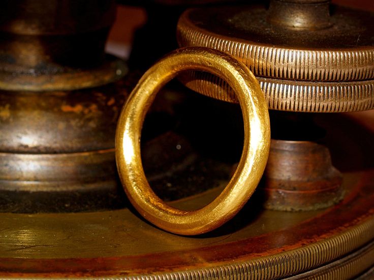 This is a solid gold ring constructed using pure 24k gold.  I start with refined .999 pure gold and melt it to red hot liquid metal, then forge it into a bar which is rolled and pulled into a smooth thick round wire, then formed into a band.  The brilliance of pure 24k (99.9% gold content) gold is unmistakable. The rich color stands out from most standard jewelry that is made from 14k (58.3% gold content) and 18k (75% gold content) jewelry. The band is a nice round shape with a thick 3mm diamete Gold Hand Forged Round Band Rings, Gold Hand Cast Rings For Anniversary, Traditional Gold Engraved Ring With Polished Finish, Hand Cast Gold Engraved Wedding Ring, Handmade Gold Engraved Ring For Formal Occasions, Formal Handmade Gold Engraved Ring, Formal Handmade Engraved Gold Ring, Heirloom Yellow Gold Bangle Ring, Gold Engraved Round Ring For Ceremonial Occasions