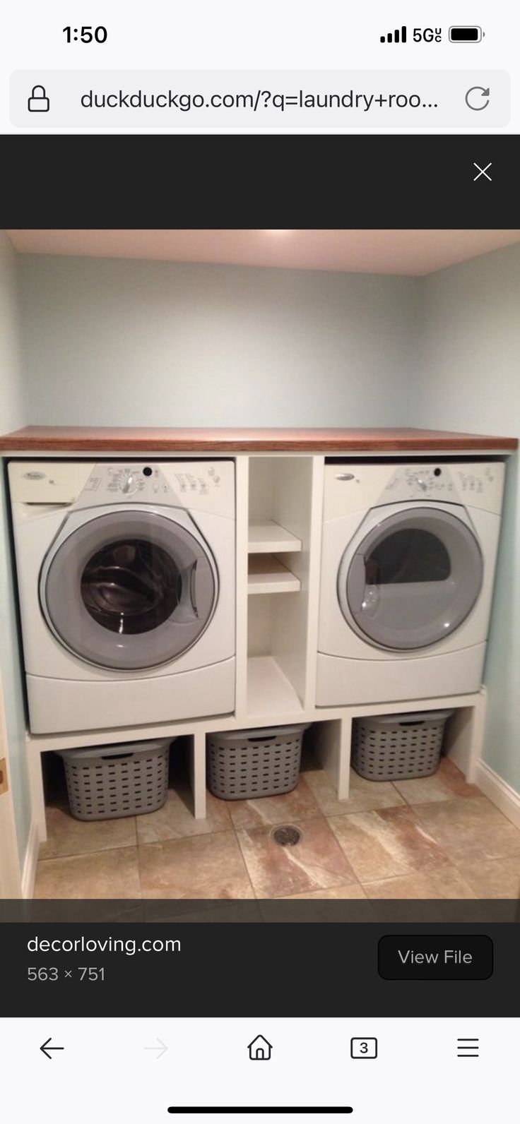 a washer and dryer are in the same room