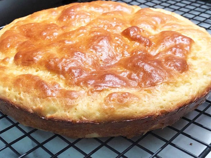 a baked pastry sitting on top of a cooling rack