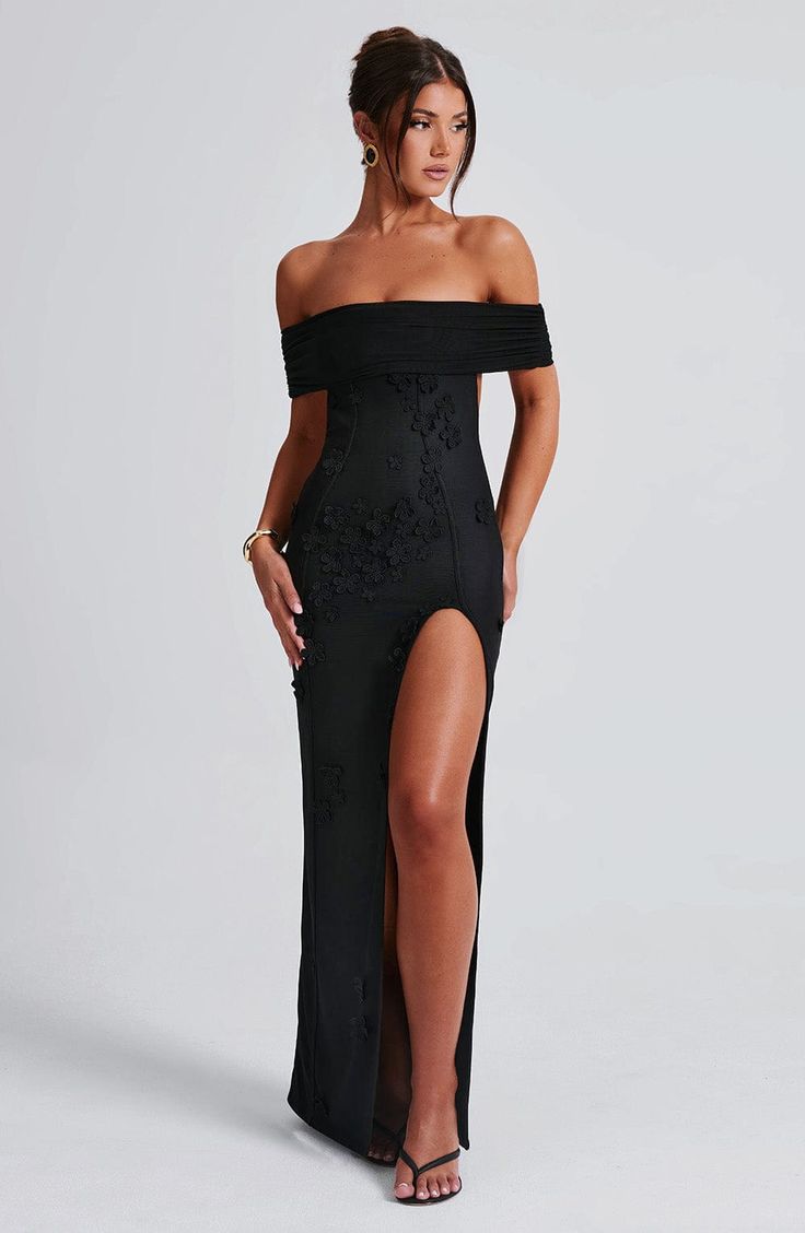 Milani is one of our dreamiest designs of the season, perfect for chasing sunsets and beyond. This maxi dress is soft girl perfection, made in a delicate mesh with playful 3D flower appliques and bardot neckline to show off your shoulders. The dress is complete with a thigh high split and open low back. 



Colour: Black.

Premium stretch mesh.

Fully lined.

3D floral appliques.

Bardot neckline.

Strap detail at back.

Cut out low back.

Thigh high split.

Invisible zip fastening.

Maxi length Chic Off-shoulder Fitted Floor-length Dress, Off-shoulder Summer Maxi Dress For Evening, Chic Fitted Floor-length Off Shoulder Dress, Summer Prom Mesh Maxi Dress, Chic Off-shoulder Floor-length Dress For Prom, Chic Floor-length Off Shoulder Prom Dress, Chic Off Shoulder Floor-length Prom Dress, Chic Floor-length Off-shoulder Prom Dress, Off-shoulder Midi Dress For Summer Gala