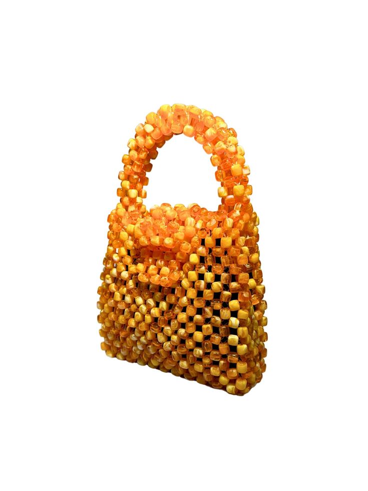 Artisan Beaded Handbag.Designed in NYC. Crafted with precision in the heart of Lagos, Nigeria.Elevate your style with our exquisite beaded handbags – a timeless accessory that seamlessly blends sophistication with versatility. Meticulously handcrafted, these bags are built to withstand the test of time. Whether paired with a cocktail dress, jeans and a tee, professional attire, or your favorite clubwear, our bead bags effortlessly complement any ensemble. Luxury Handwoven Bags For Gifts, Formal Beaded Shoulder Bag With Top Handle, Formal Beaded Top Handle Shoulder Bag, Luxury Handheld Beaded Shoulder Bag, Elegant Top Handle Handwoven Bag, Luxury Beaded Top Handle Evening Bag, Luxury Handheld Beaded Evening Bag, Luxury Beaded Handheld Evening Bag, Elegant Handwoven Top Handle Bag